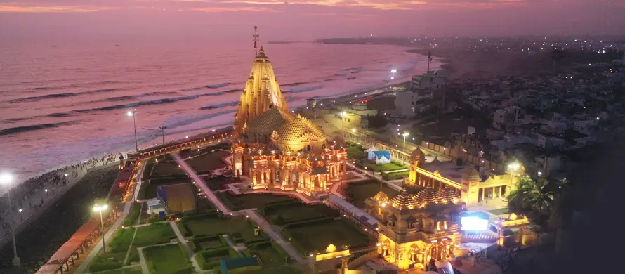 Aerial view of Somnath Temple and the seafront at dusk